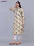 Cotton a-line kurti cream and green shade with allover butta prints & simpe neck pattern without pant