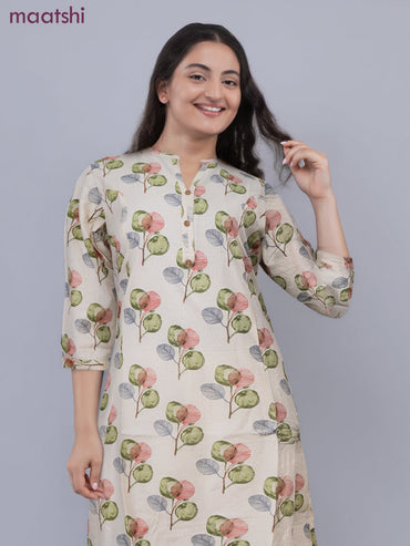 Cotton a-line kurti cream and green shade with allover butta prints & simpe neck pattern without pant
