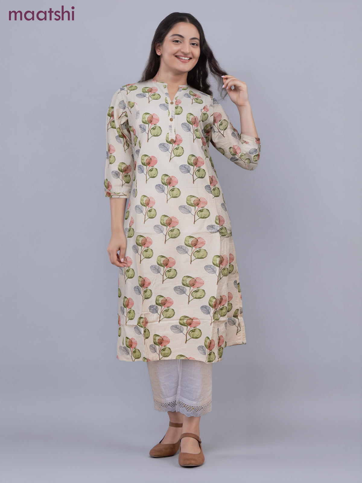 Cotton a-line kurti cream and green shade with allover butta prints & simpe neck pattern without pant
