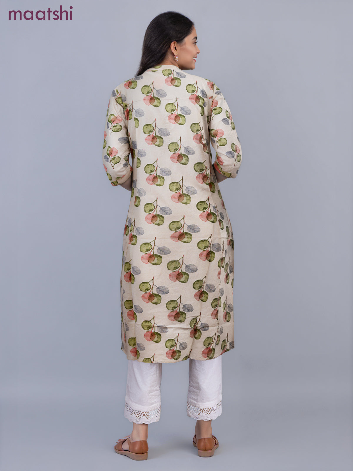 Cotton a-line kurti cream and green shade with allover butta prints & simpe neck pattern without pant