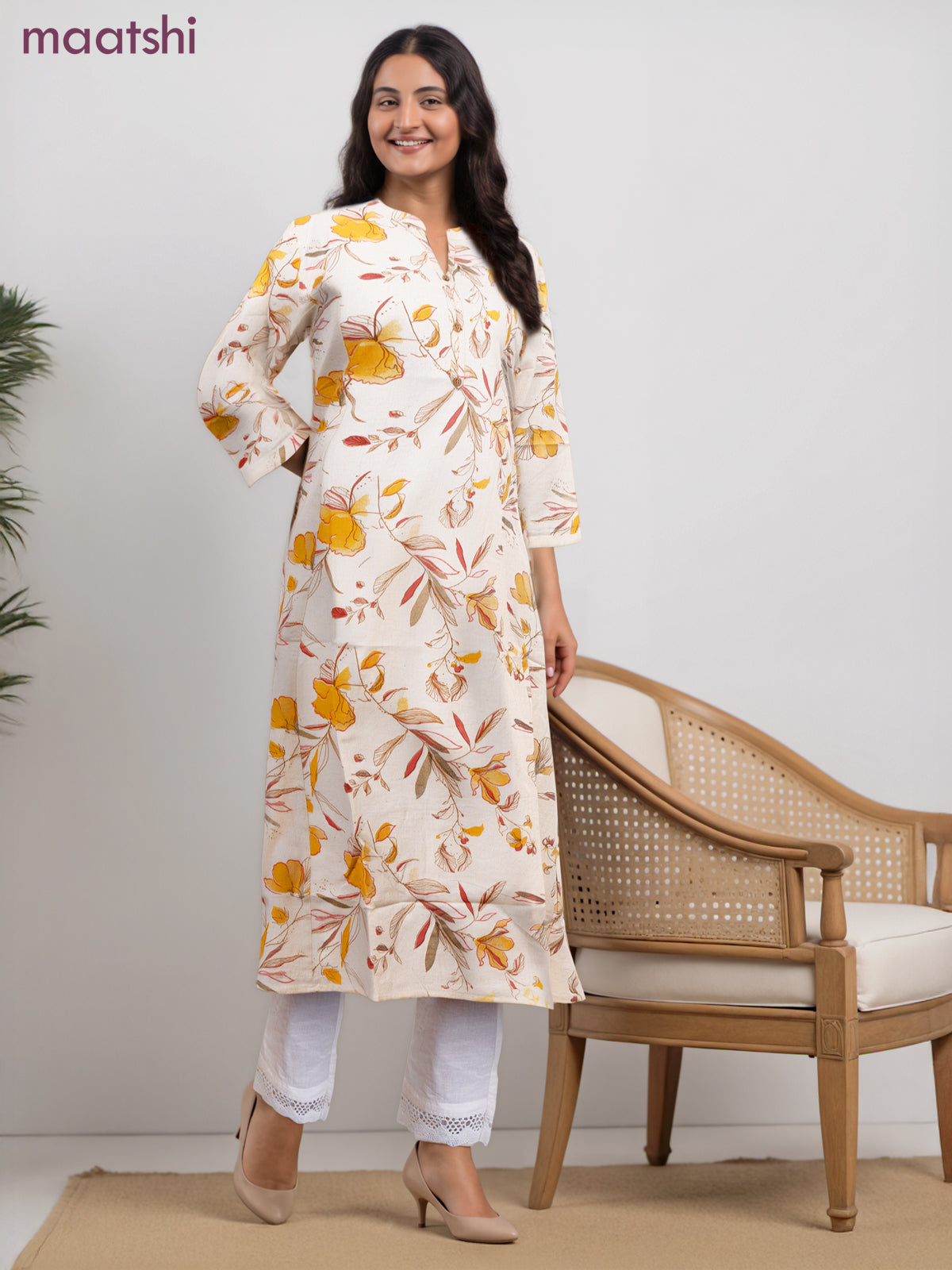 Cotton a-line kurti cream and yellow shade with allover floral prints & simple neck pattern without pant