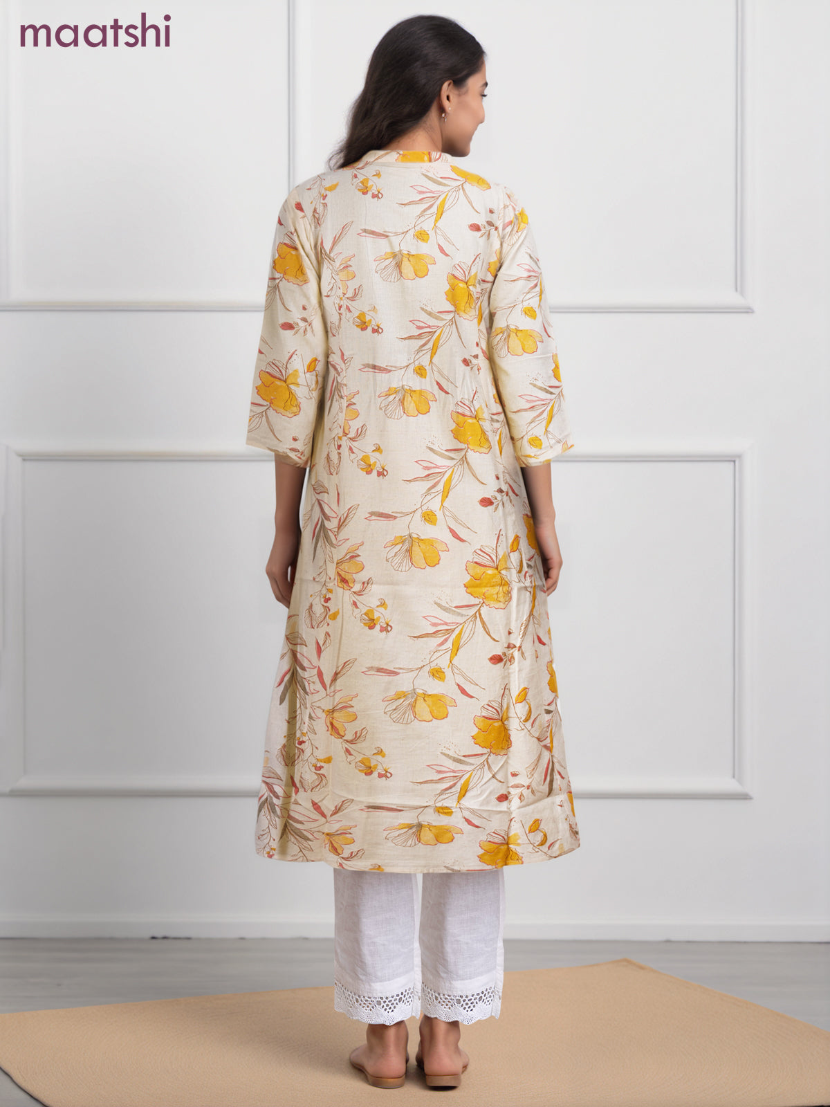 Cotton a-line kurti cream and yellow shade with allover floral prints & simple neck pattern without pant