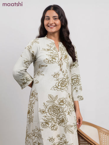 Cotton a-line kurti cream and green shade with allover floral prints & simple neck pattern without pant