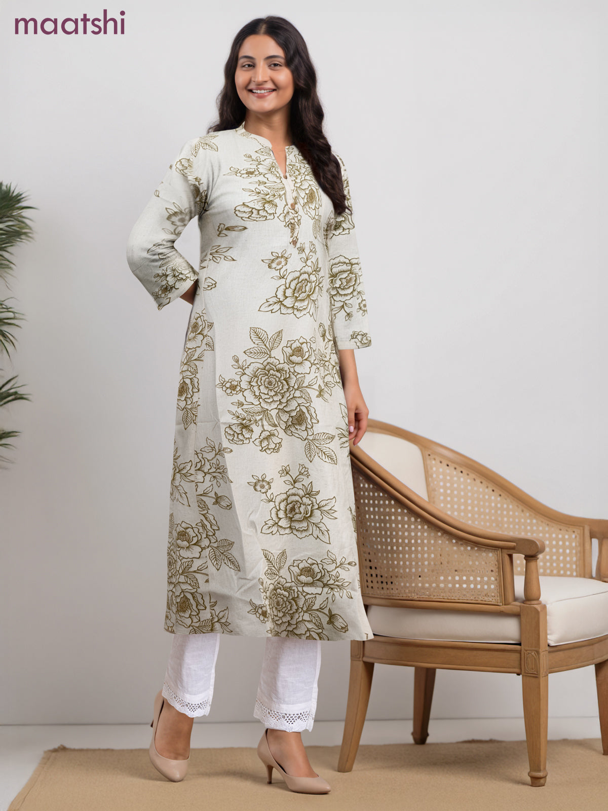 Cotton a-line kurti cream and green shade with allover floral prints & simple neck pattern without pant