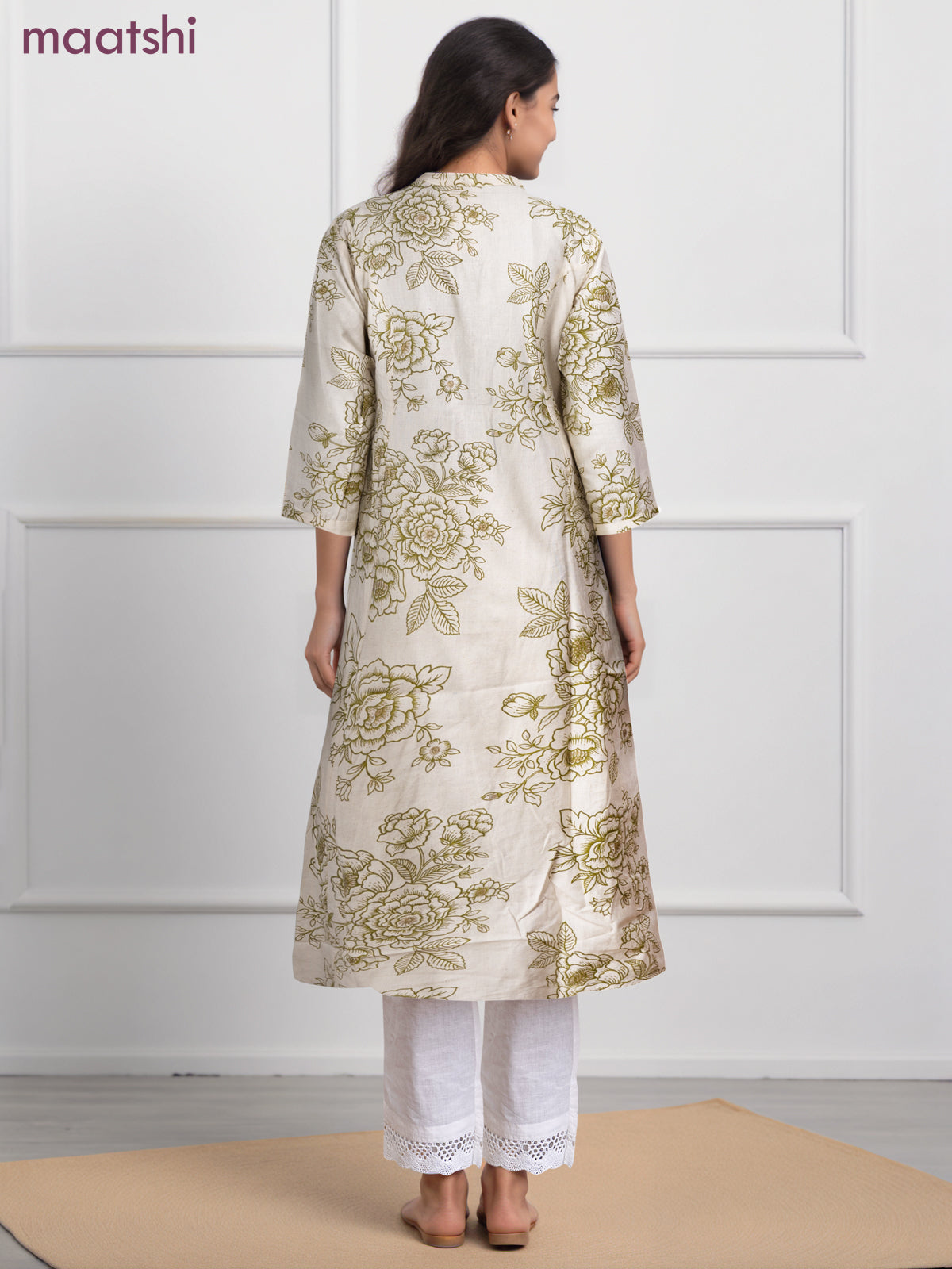 Cotton a-line kurti cream and green shade with allover floral prints & simple neck pattern without pant
