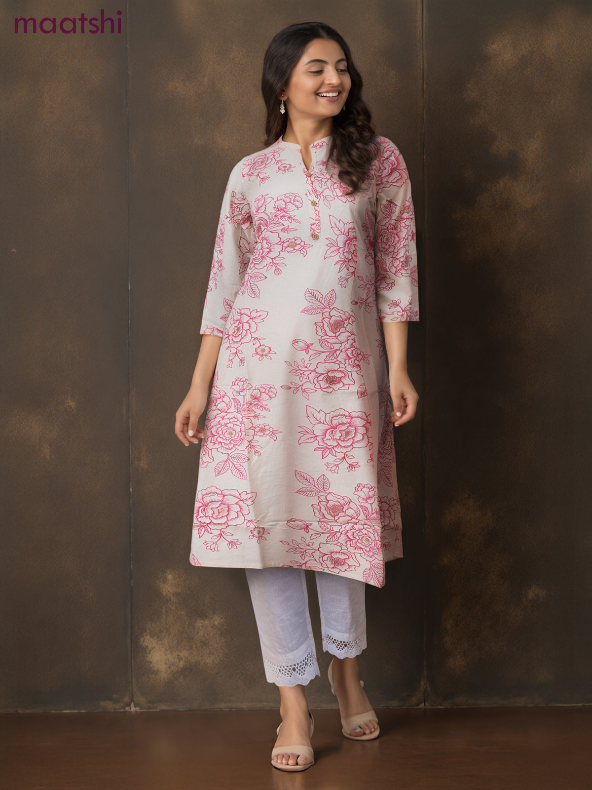 Cotton a-line kurti cream and pink shade with allover floral prints & simple neck pattern without pant