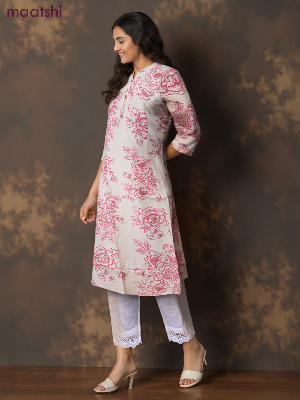 Cotton a-line kurti cream and pink shade with allover floral prints & simple neck pattern without pant