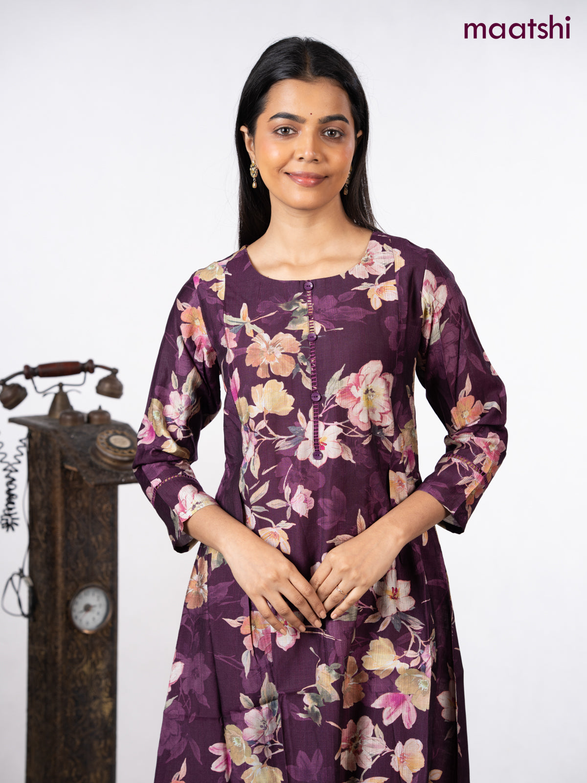 Rayon a-line kurti wine shade with allover floral prints & simple neck pattern without pant