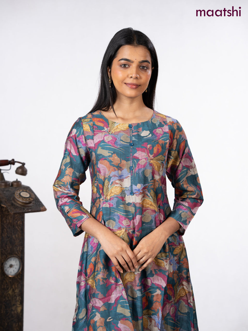Rayon a-line kurti peacock blue with allover floral prints & simple neck pattern without pant