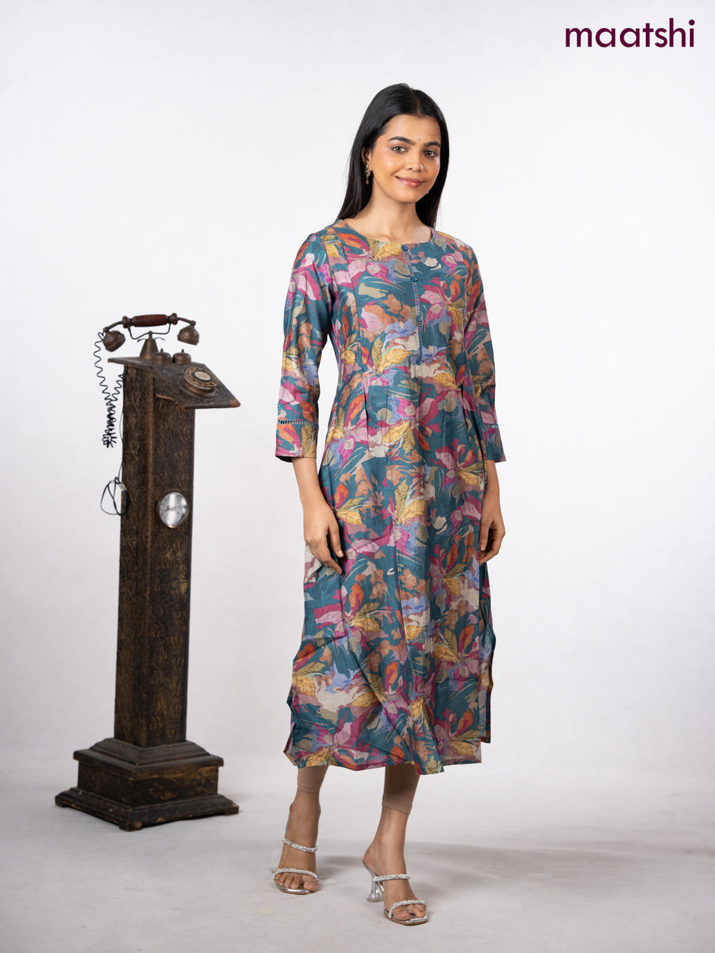 Rayon a-line kurti peacock blue with allover floral prints & simple neck pattern without pant