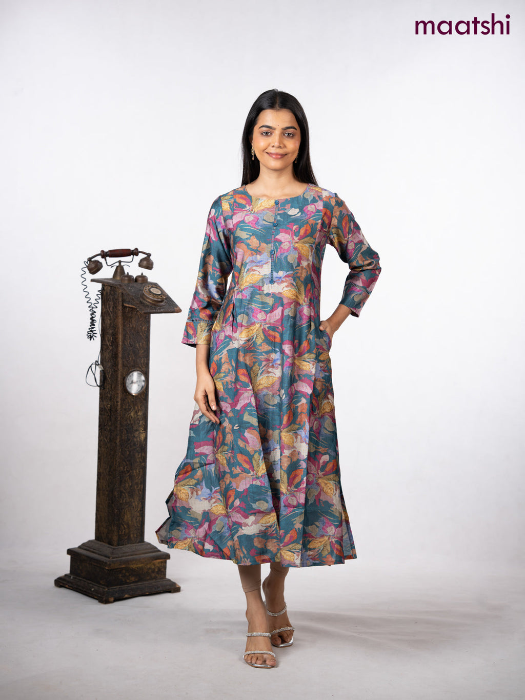 Rayon a-line kurti peacock blue with allover floral prints & simple neck pattern without pant