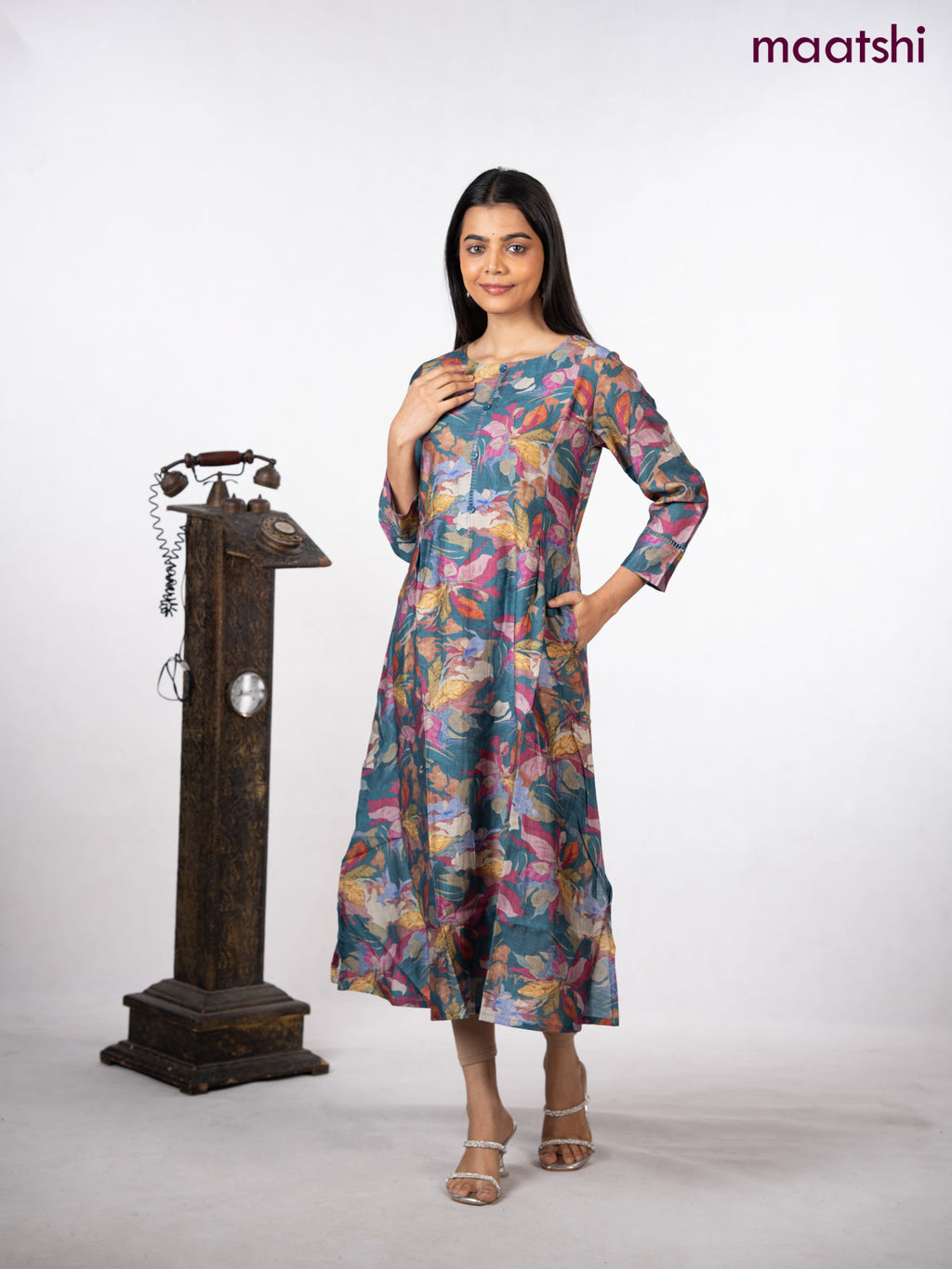 Rayon a-line kurti peacock blue with allover floral prints & simple neck pattern without pant