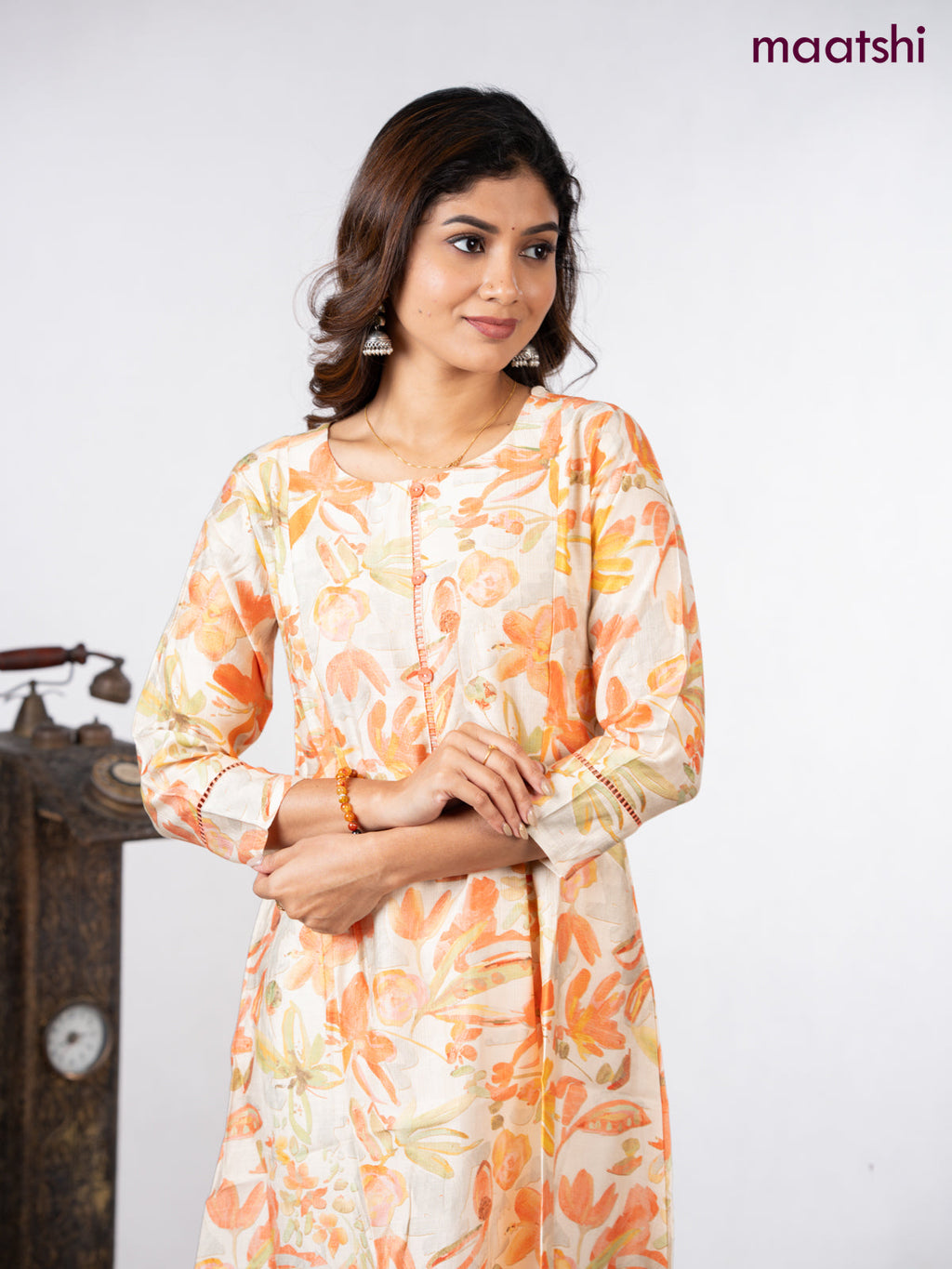 Rayon a-line kurti cream with allover floral prints & simple neck pattern without pant