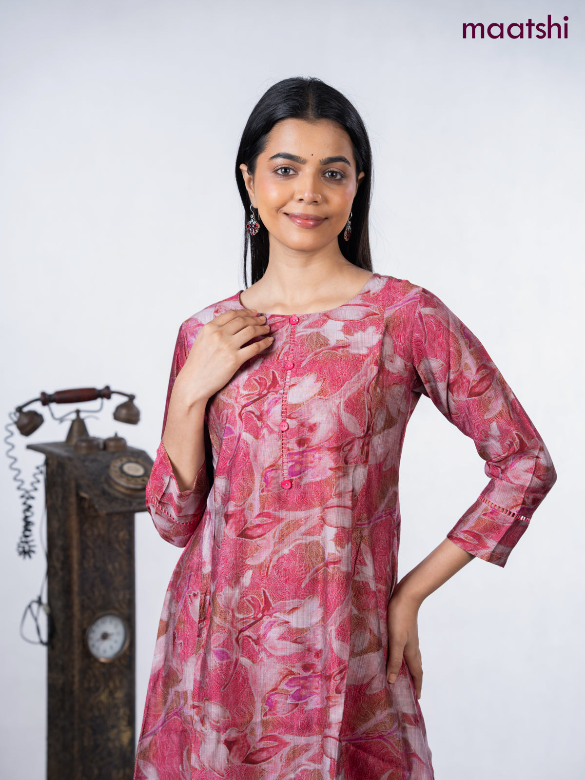 Rayon a-line kurti maroon shade with allover prints & simple neck pattern without pant