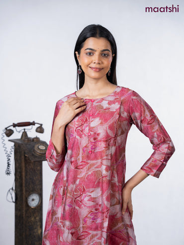 Rayon a-line kurti maroon shade with allover prints & simple neck pattern without pant