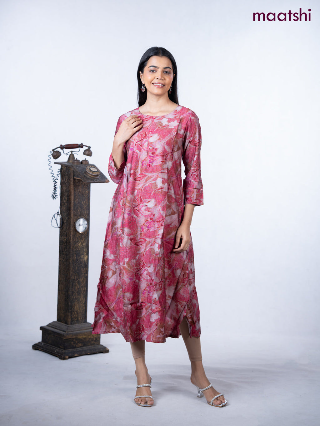 Rayon a-line kurti maroon shade with allover prints & simple neck pattern without pant