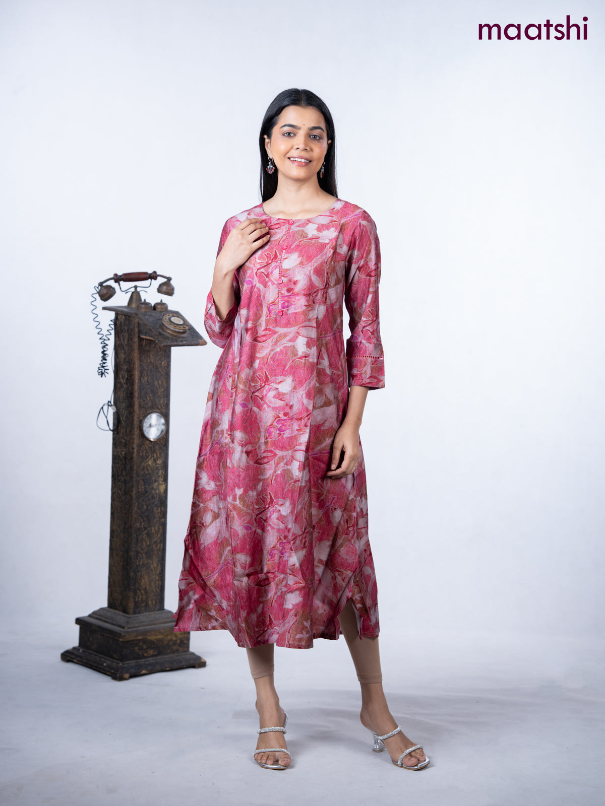 Rayon a-line kurti maroon shade with allover prints & simple neck pattern without pant