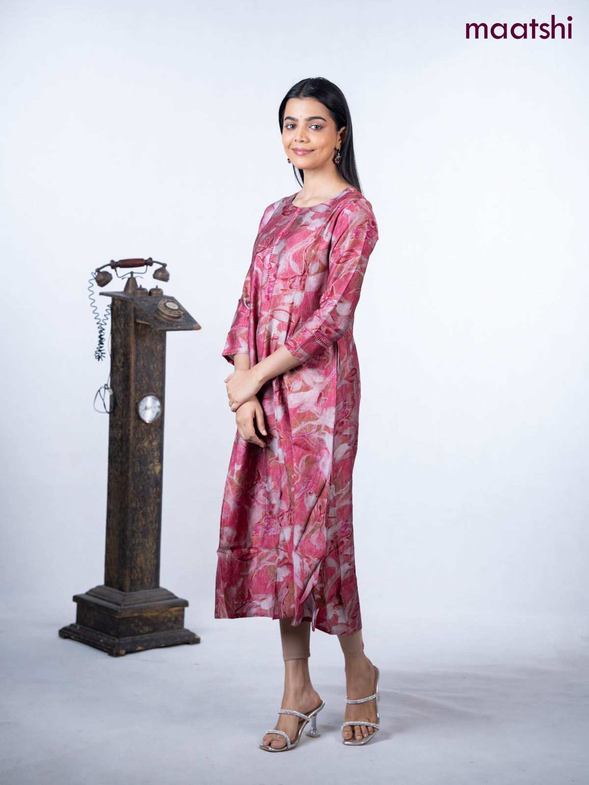 Rayon a-line kurti maroon shade with allover prints & simple neck pattern without pant
