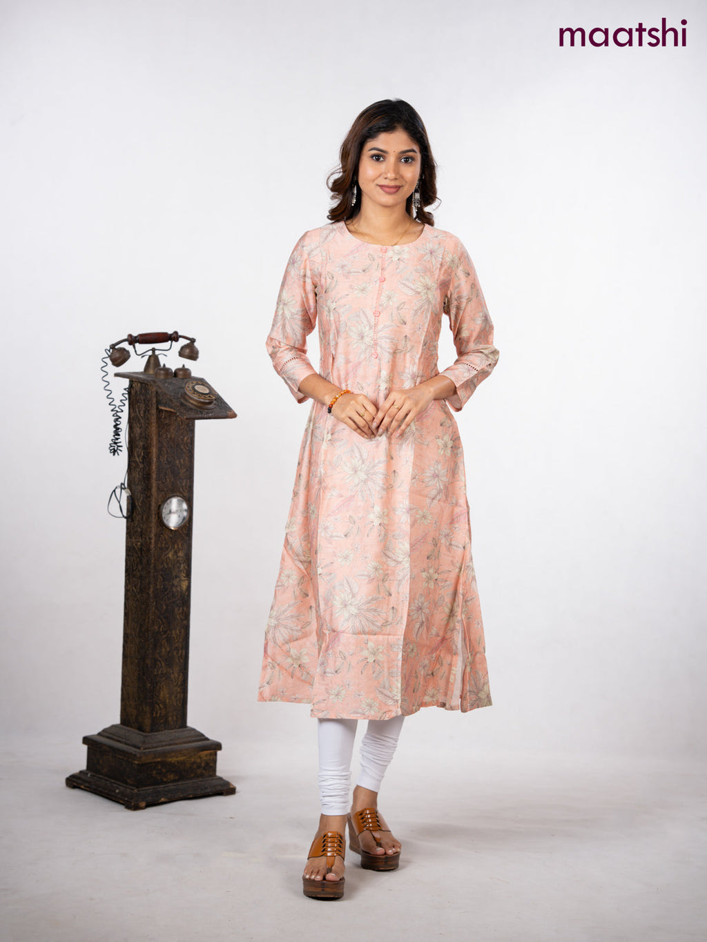 Rayon a-line kurti peach shade with allover floral prints & simple neck pattern without pant