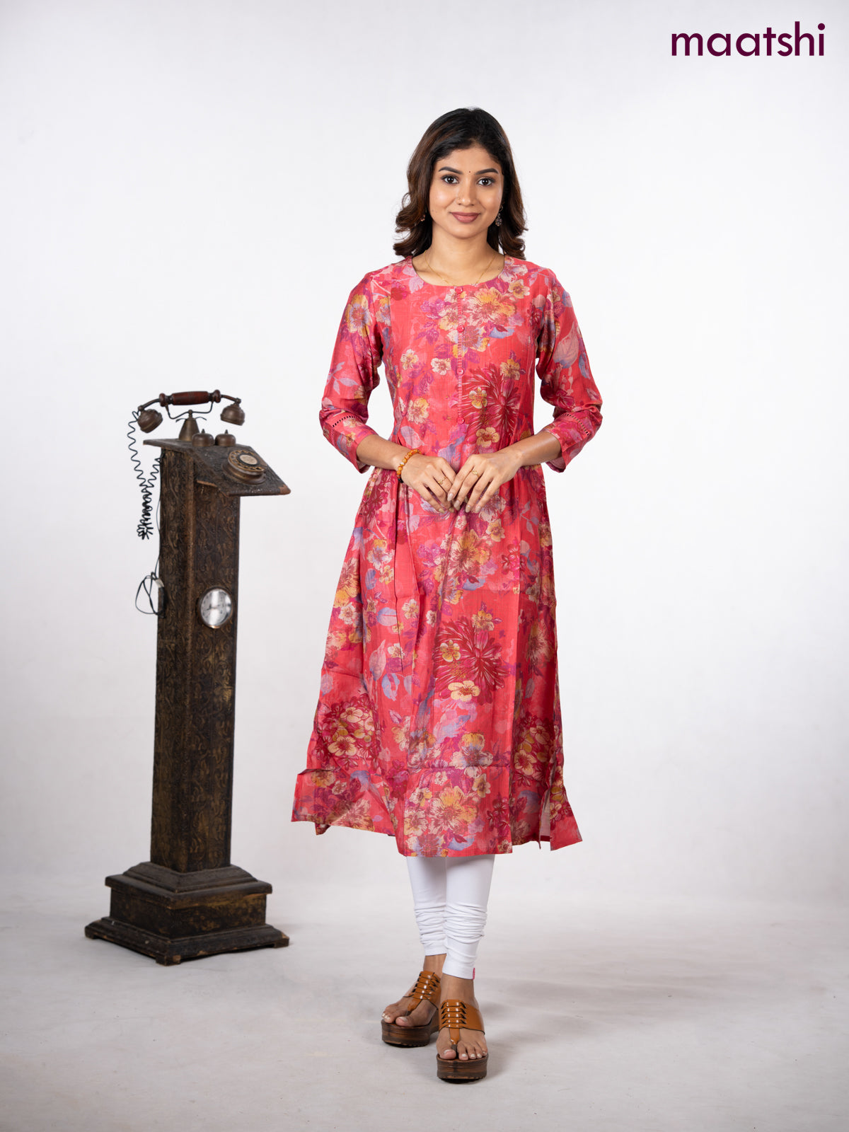 Rayon a-line kurti peach pink with allover floral prints & simple neck pattern without pant