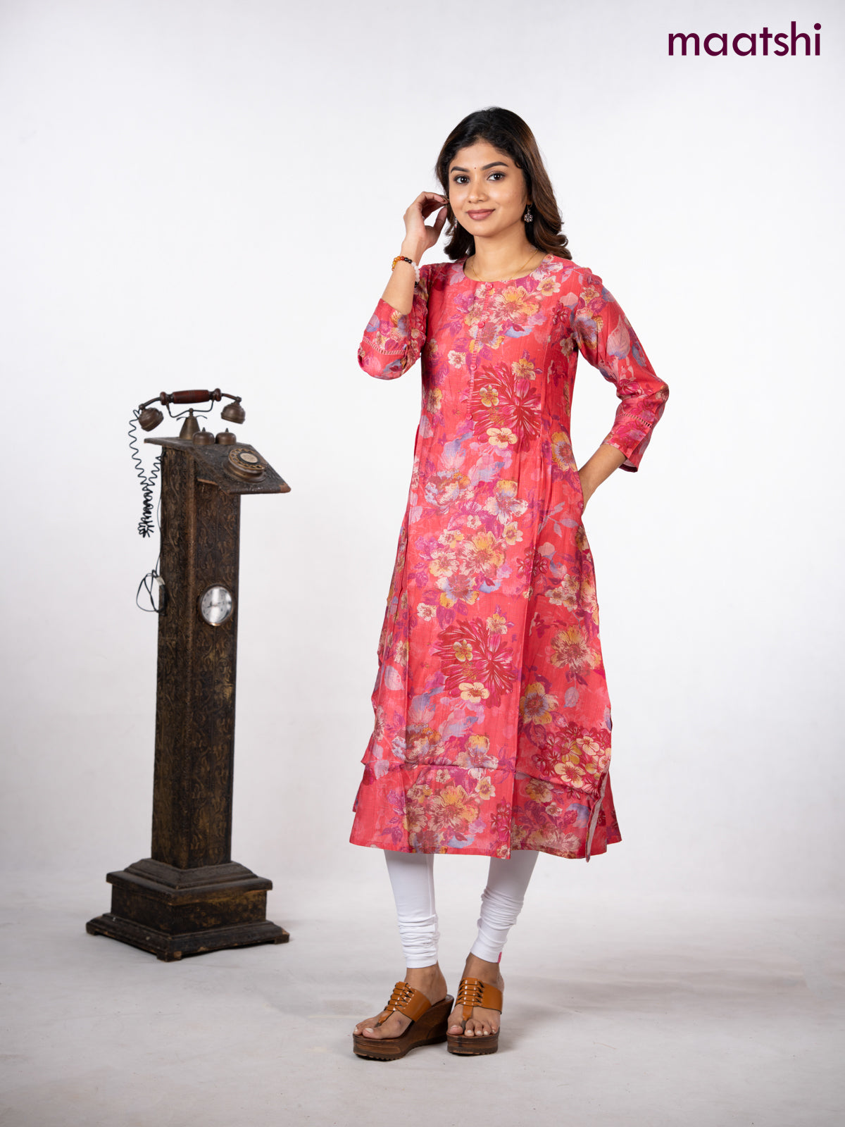 Rayon a-line kurti peach pink with allover floral prints & simple neck pattern without pant