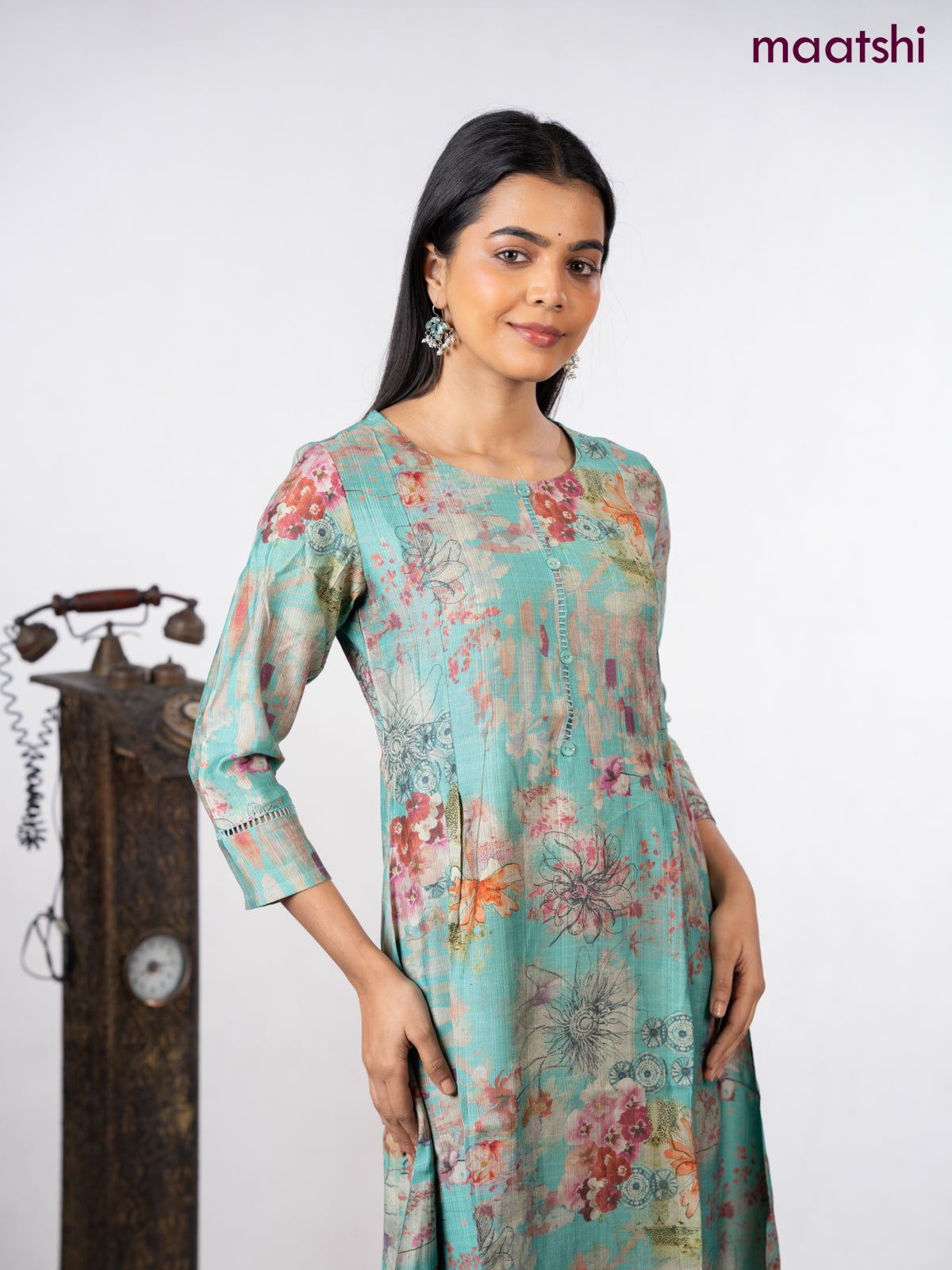 Rayon a-line kurti teal green with allover floral prints & simple neck pattern without pant