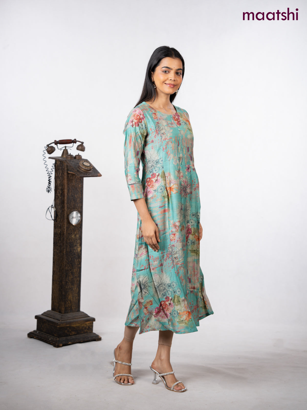 Rayon a-line kurti teal green with allover floral prints & simple neck pattern without pant