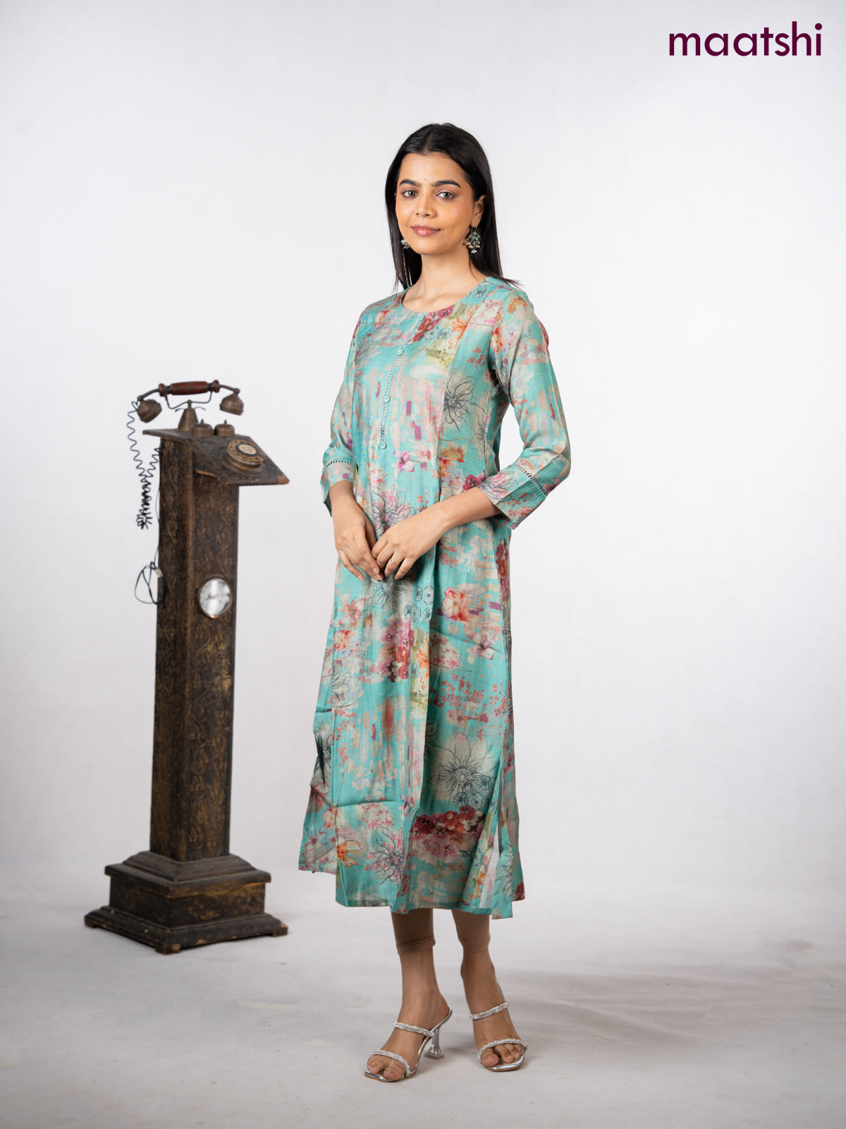 Rayon a-line kurti teal green with allover floral prints & simple neck pattern without pant
