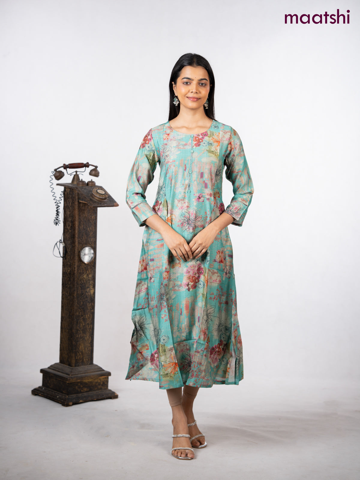 Rayon a-line kurti teal green with allover floral prints & simple neck pattern without pant