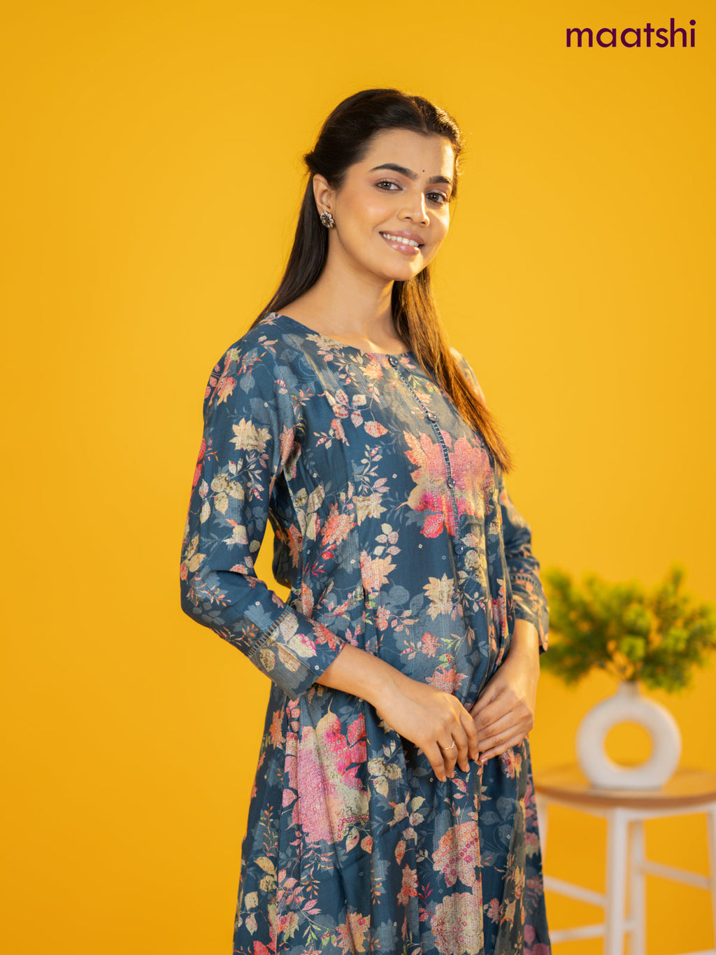 Rayon a-line kurti peacock blue with allover floral prints & simple neck pattern without pant