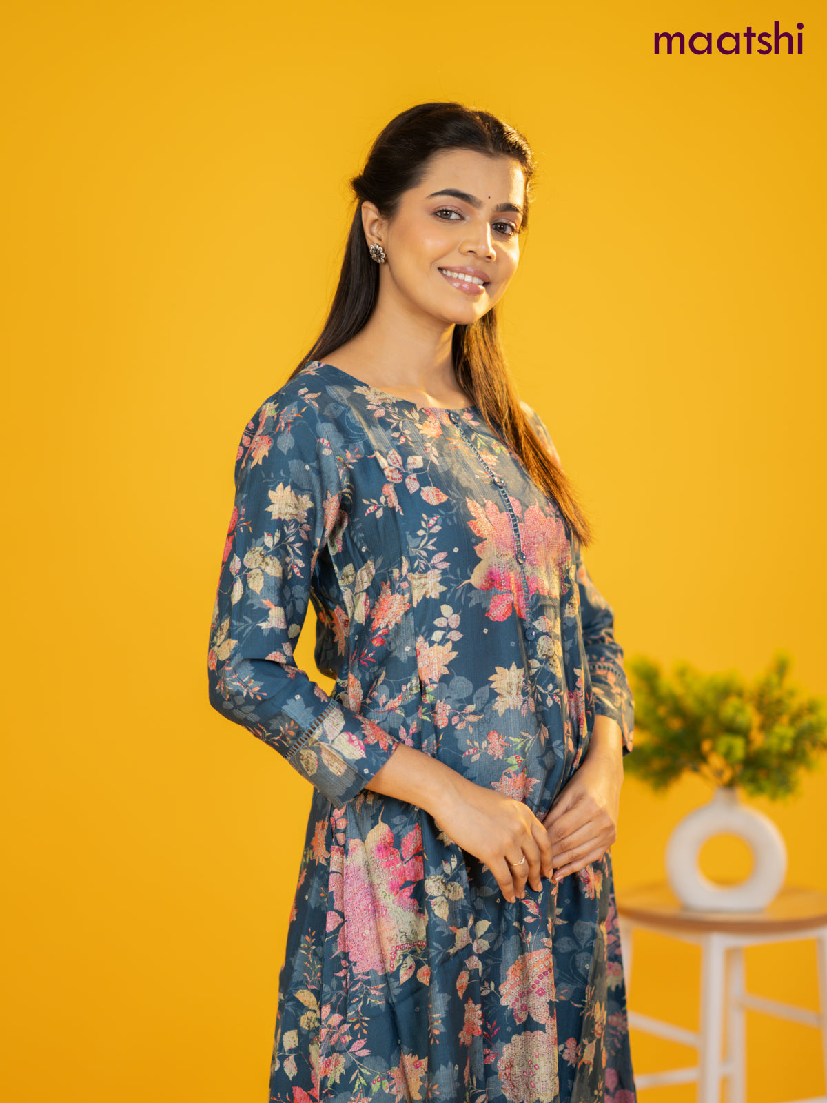 Rayon a-line kurti peacock blue with allover floral prints & simple neck pattern without pant