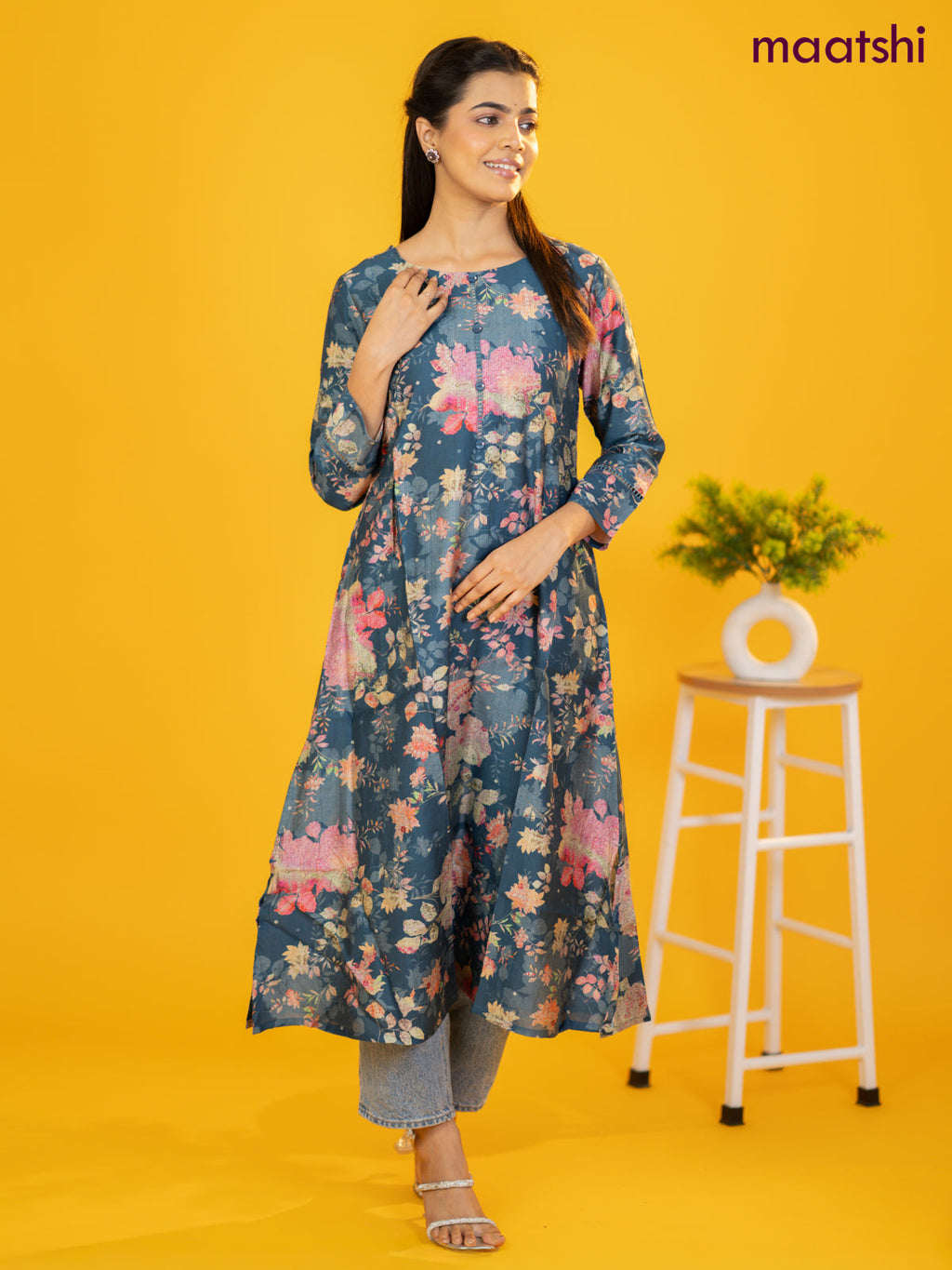 Rayon a-line kurti peacock blue with allover floral prints & simple neck pattern without pant
