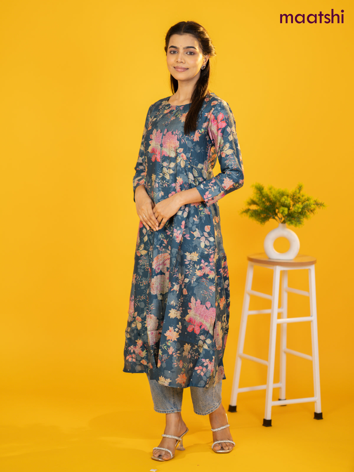 Rayon a-line kurti peacock blue with allover floral prints & simple neck pattern without pant