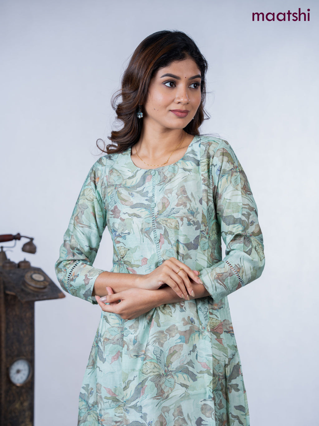 Rayon a-line kurti teal green shade with allover floral prints & simple neck pattern without pant