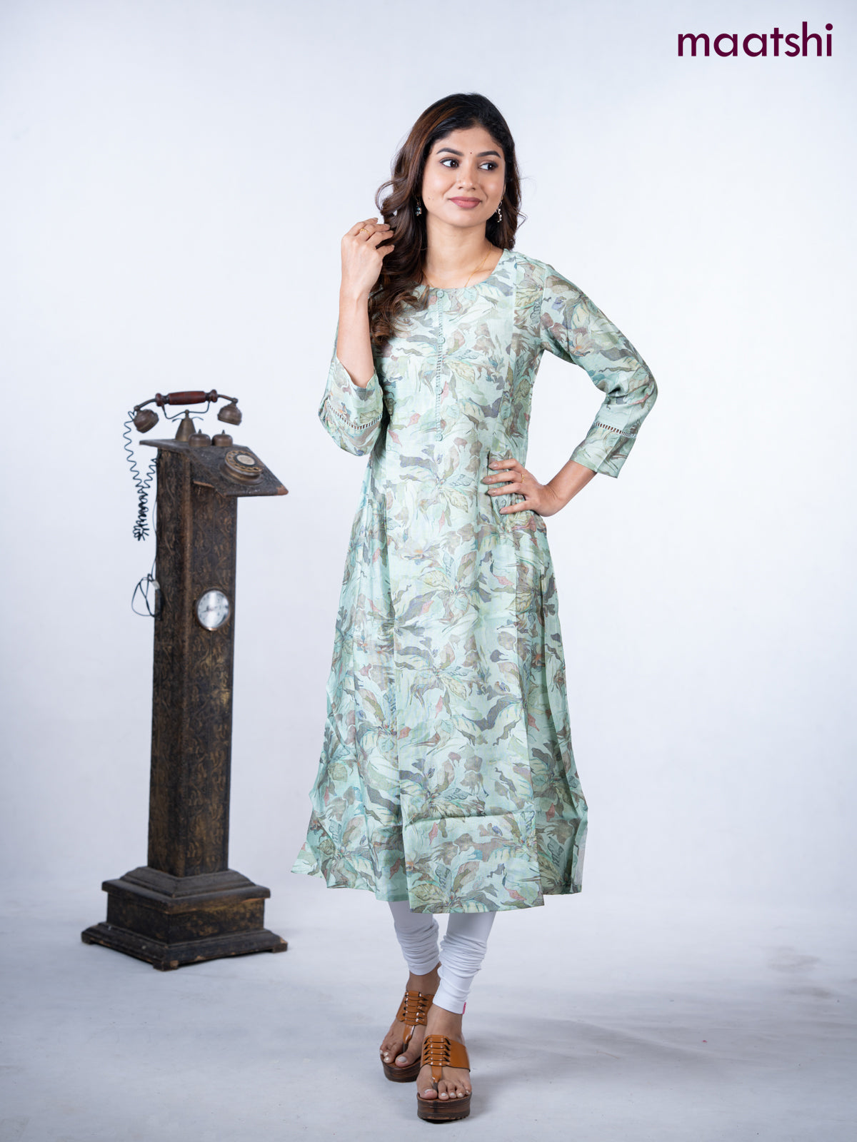 Rayon a-line kurti teal green shade with allover floral prints & simple neck pattern without pant