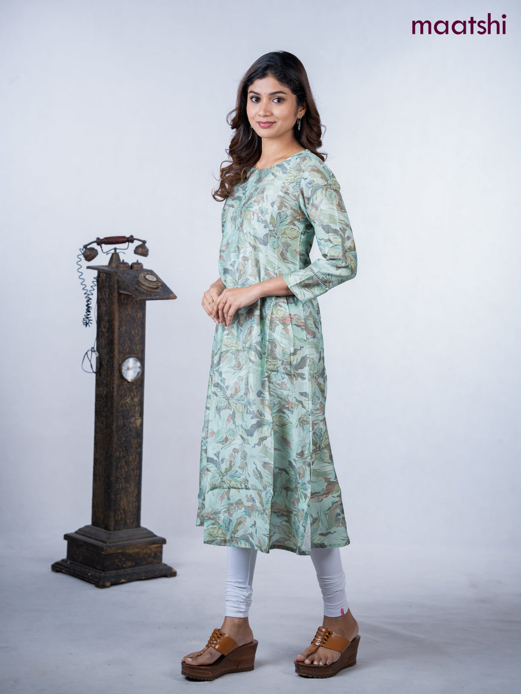 Rayon a-line kurti teal green shade with allover floral prints & simple neck pattern without pant