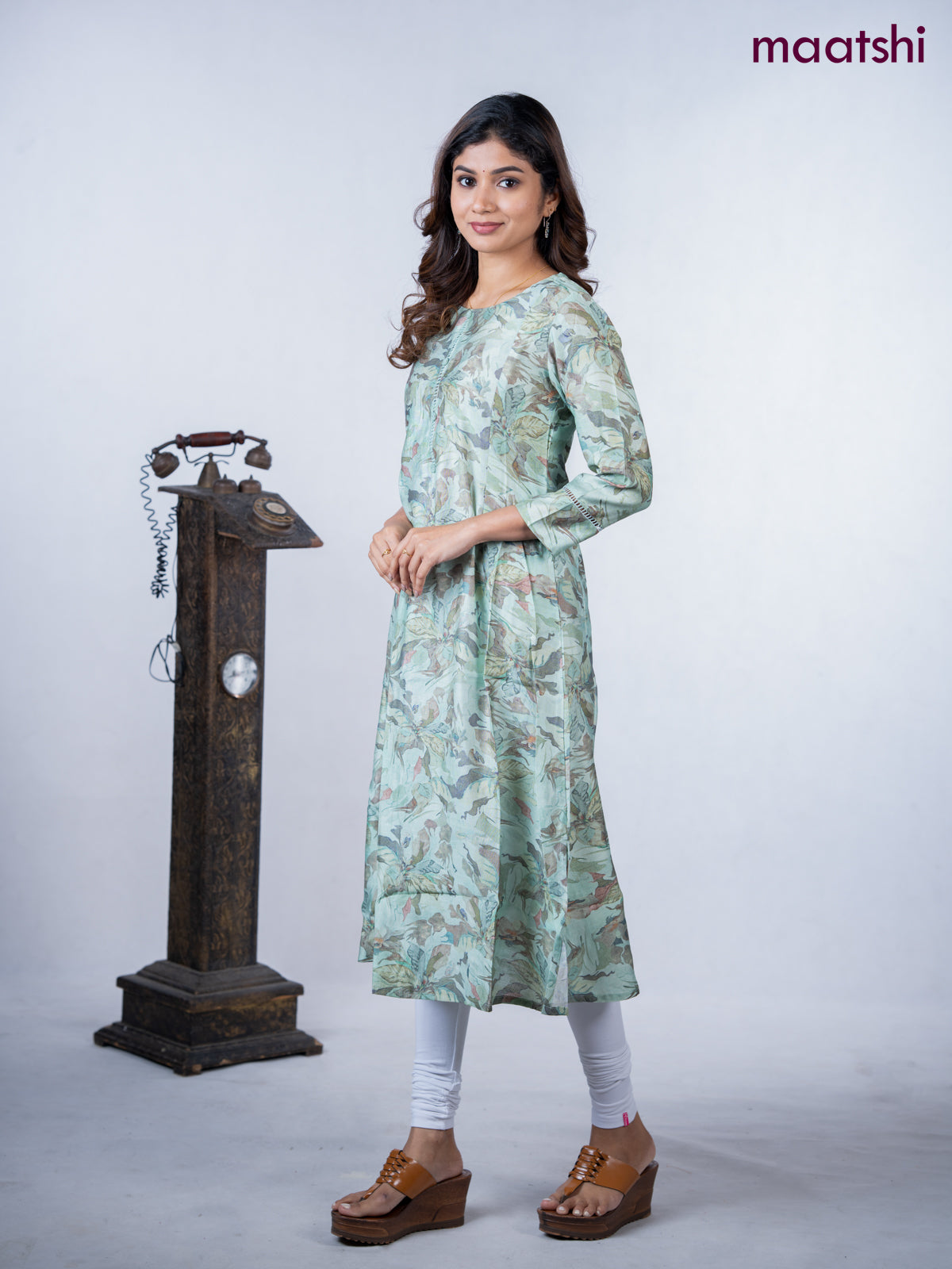 Rayon a-line kurti teal green shade with allover floral prints & simple neck pattern without pant