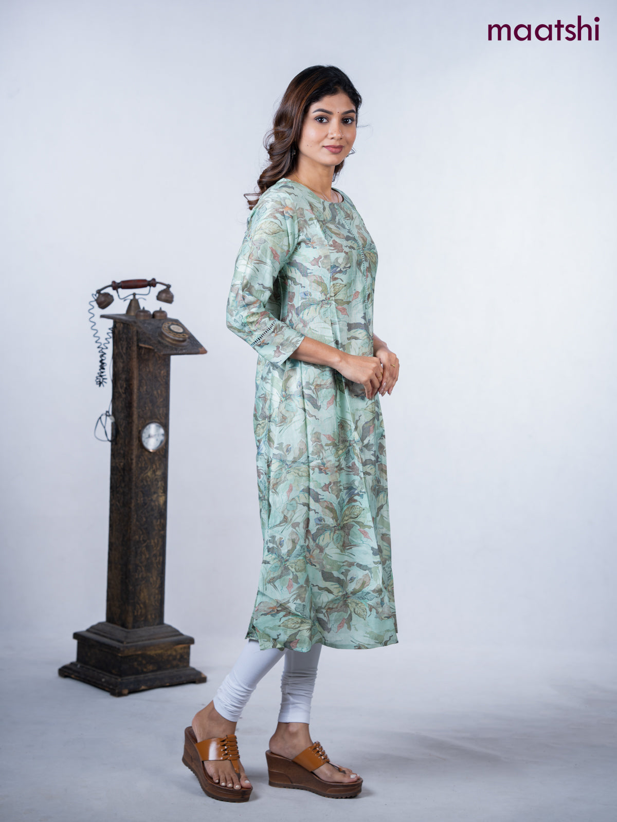 Rayon a-line kurti teal green shade with allover floral prints & simple neck pattern without pant