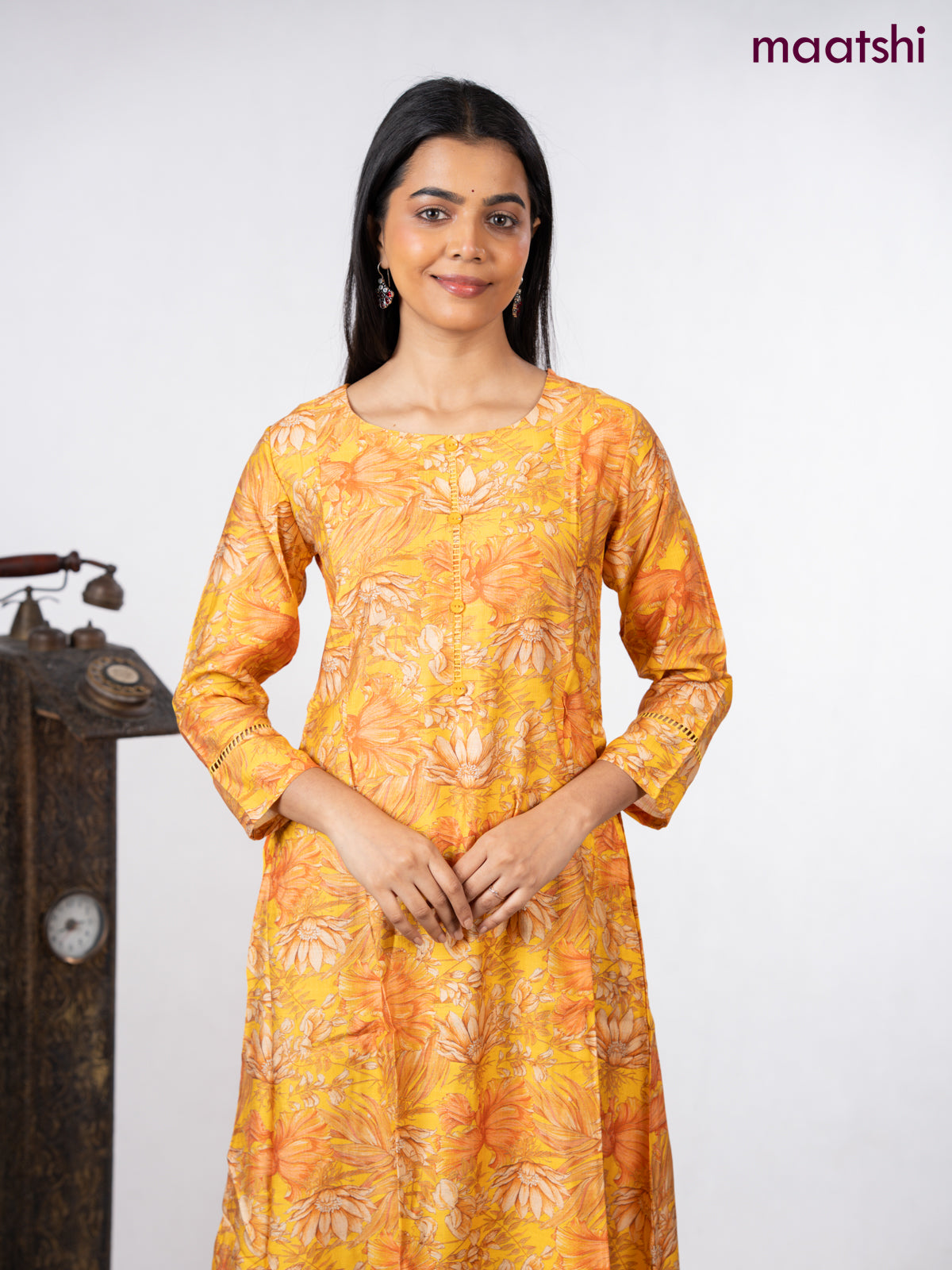 Rayon a-line kurti yellow with allover floral prints & simple neck pattern without pant