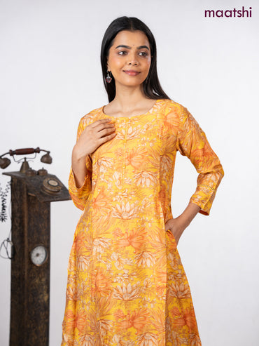 Rayon a-line kurti yellow with allover floral prints & simple neck pattern without pant