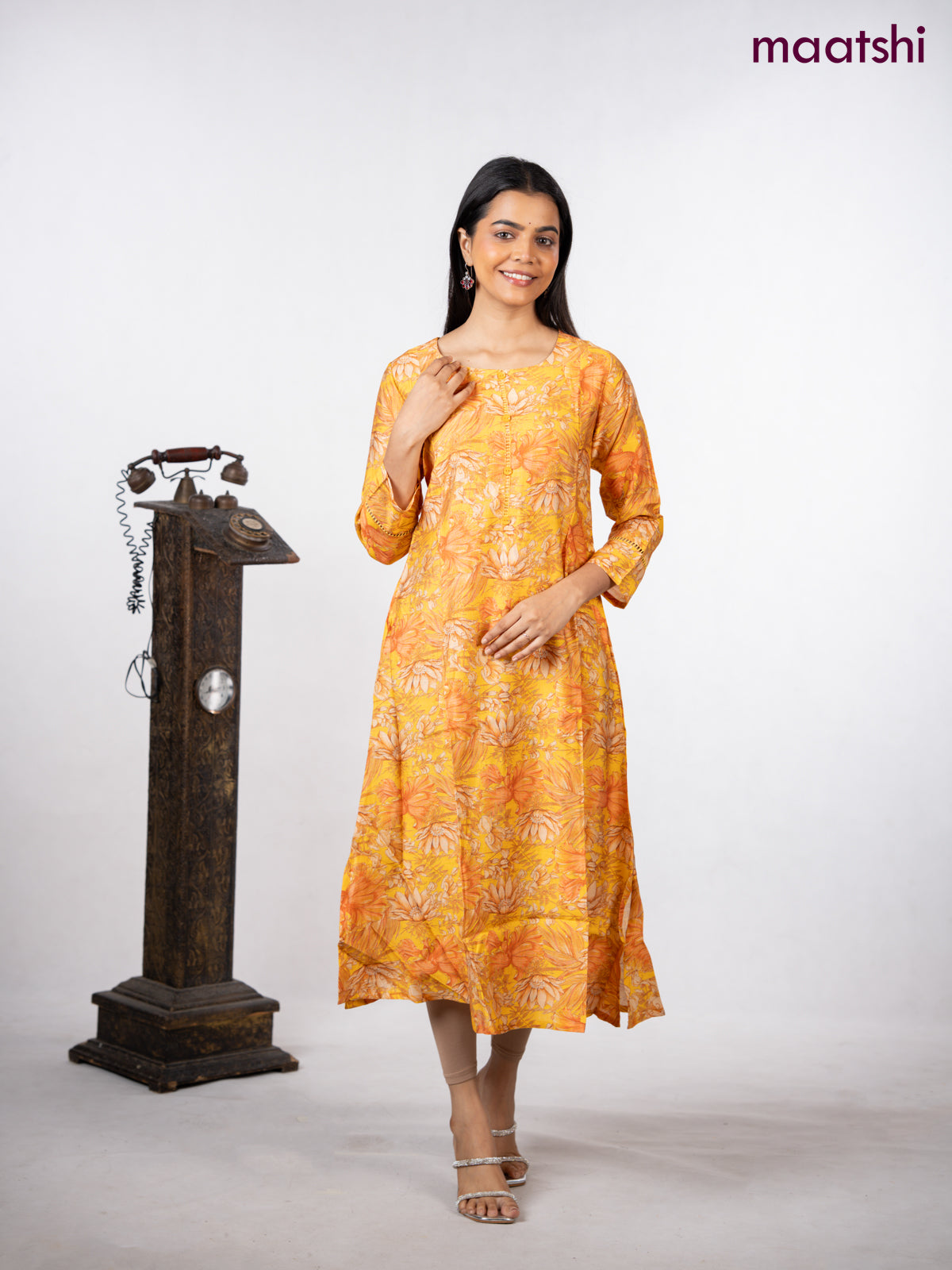 Rayon a-line kurti yellow with allover floral prints & simple neck pattern without pant