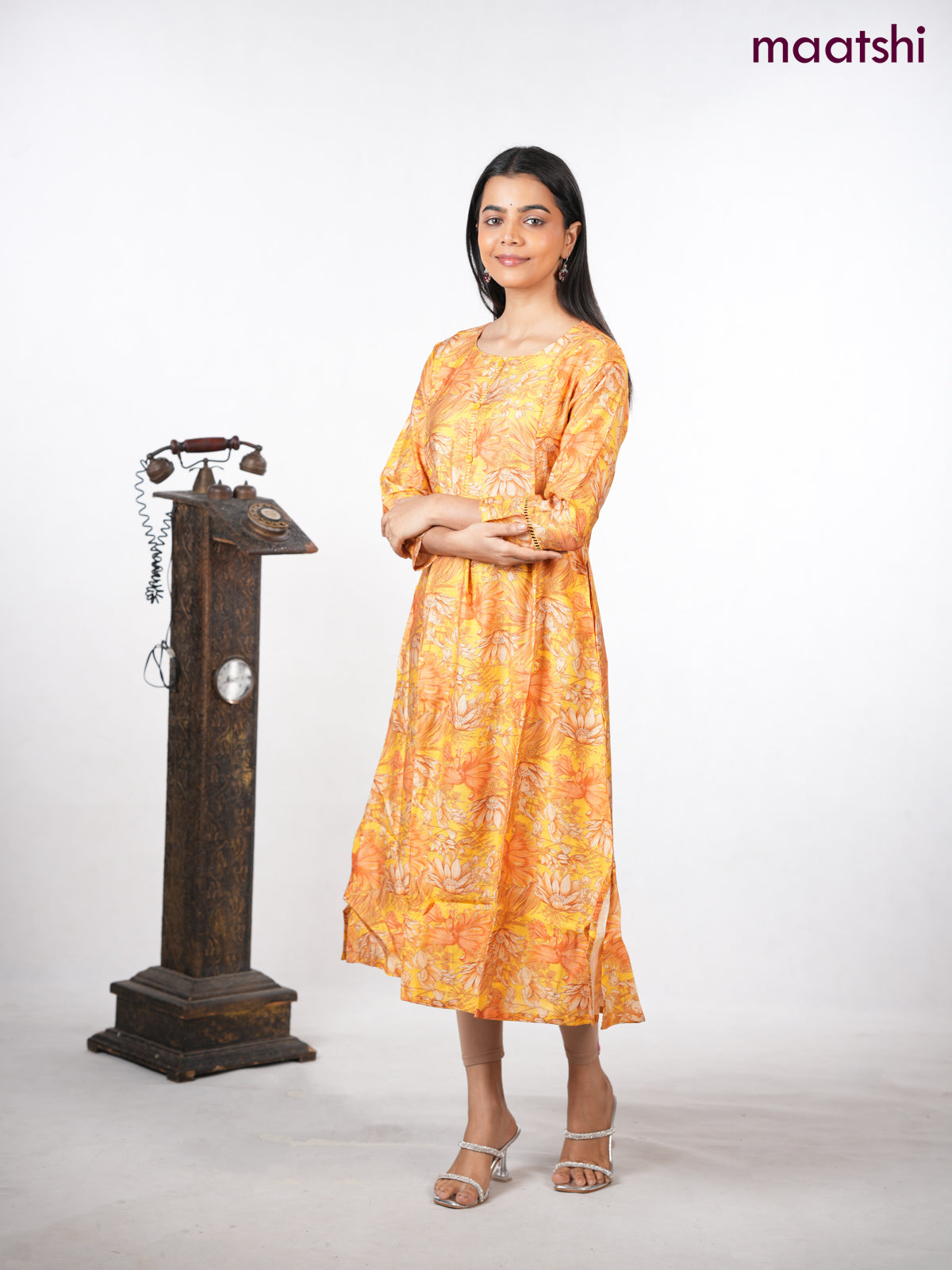 Rayon a-line kurti yellow with allover floral prints & simple neck pattern without pant