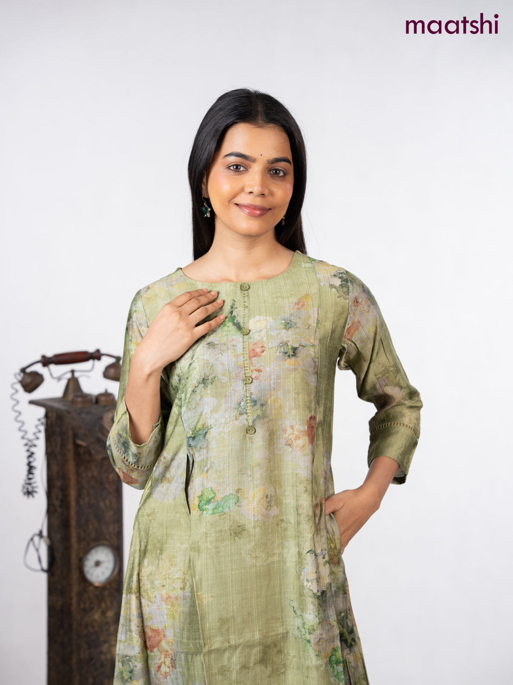 Rayon a-line kurti green with allover prints & simple neck pattern without pant