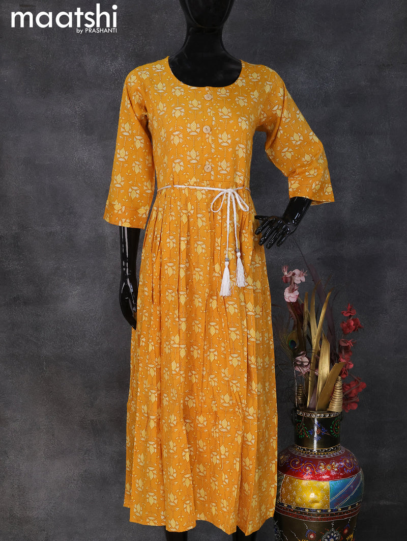 Rayon readymade umbrella kurti yellow with allover prints & simple neck pattern and without pant