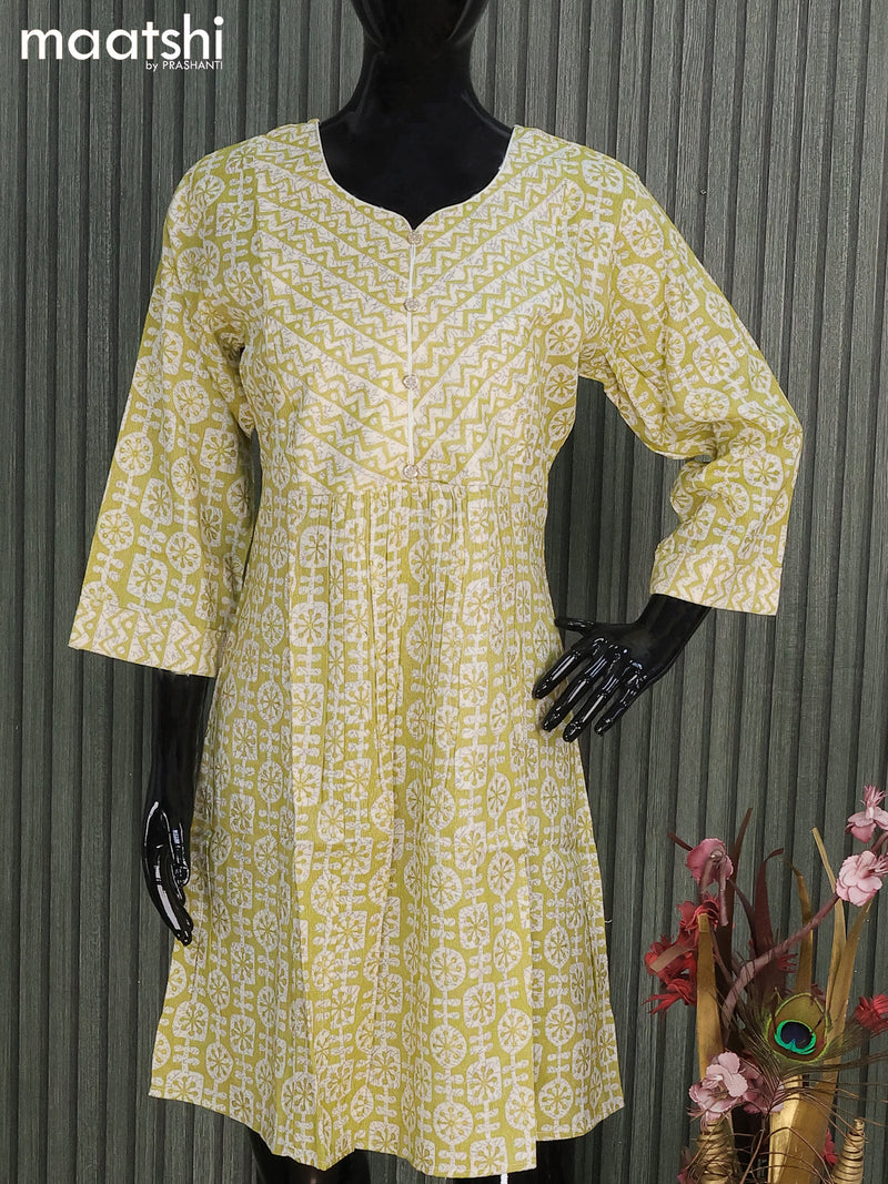 Rayon readymade short umbrella kurti off white and light green with allover batik prints & simple neck pattern and without pant