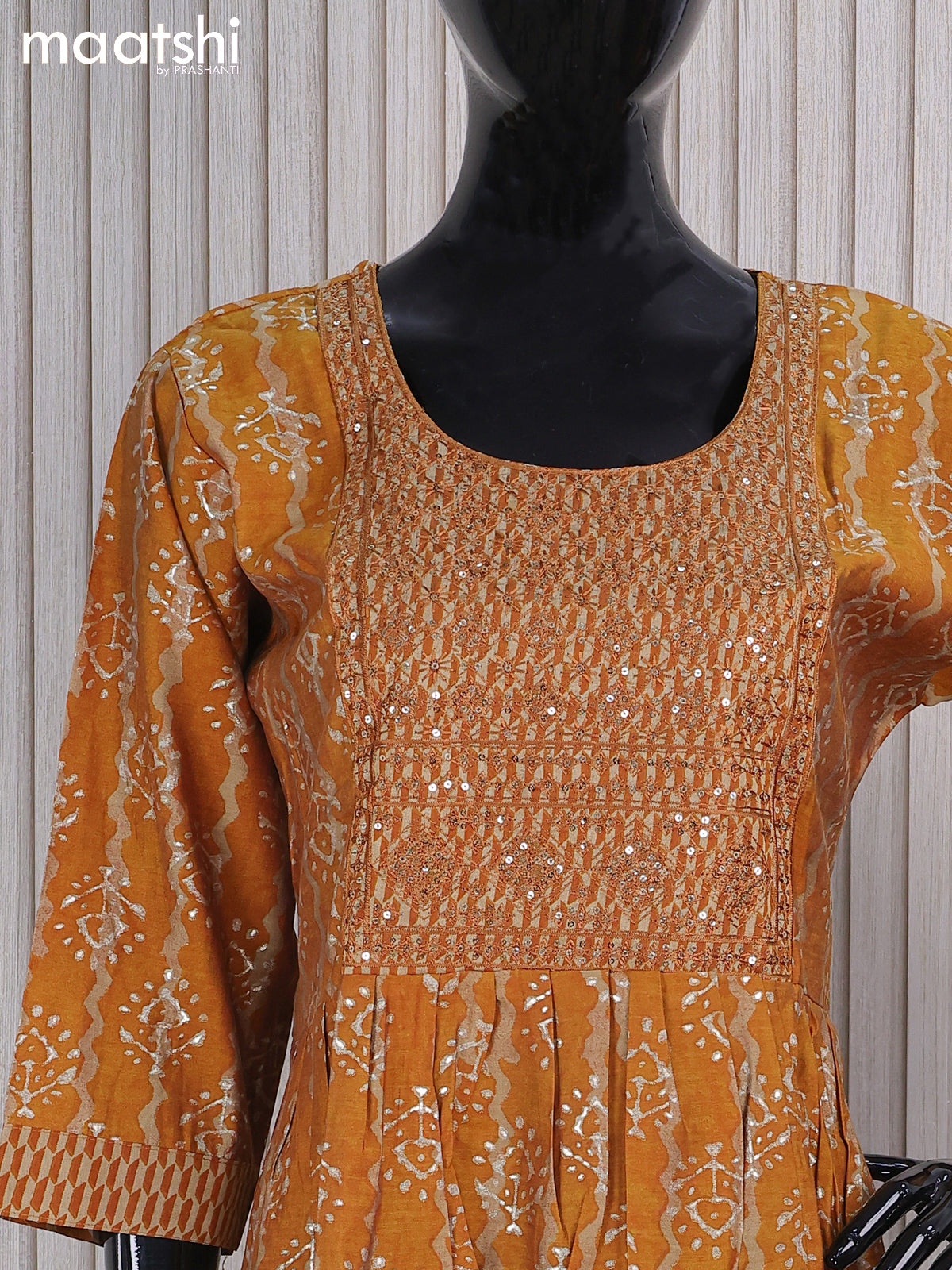Muslin readymade naira cut salwar suits mustard shade and with allover butta prints & sequin work neck pattern and straight cut pant & printed dupatta