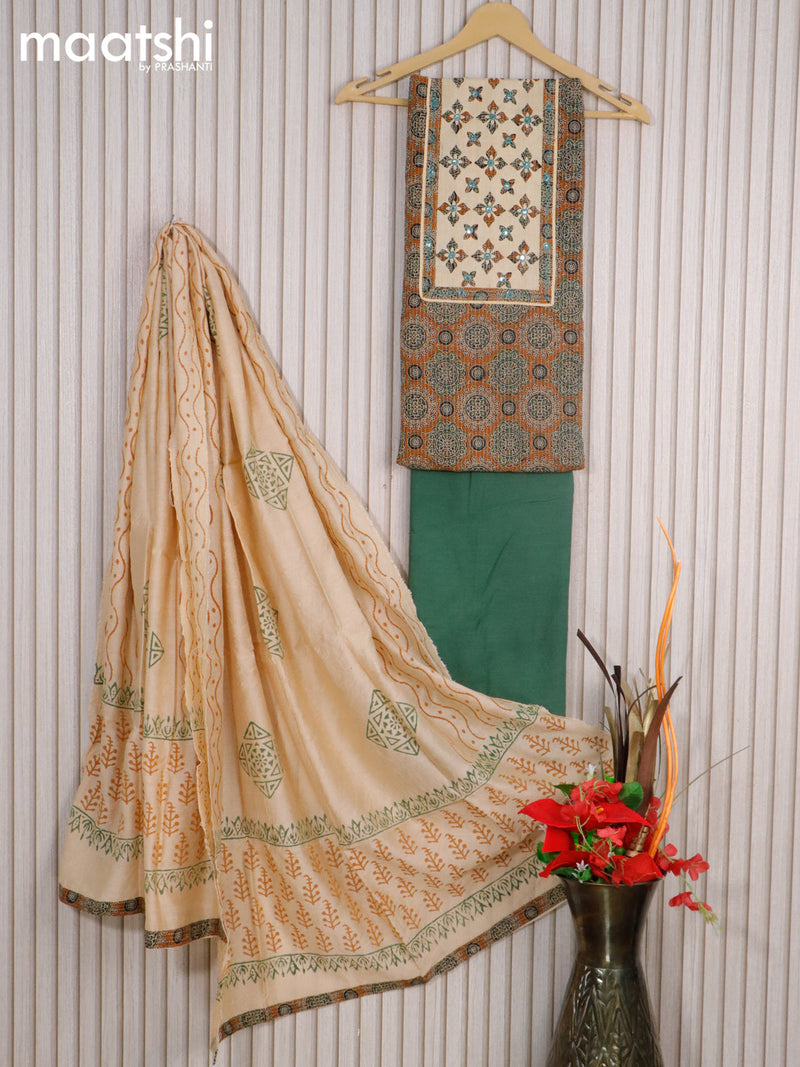 Cotton dress material dark mustard and green with allover ajrakh prints & mirror work neck pattern and bottom & chanderi dupatta