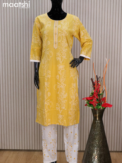Cotton readymade salwar suits yellow and off white with allover prints & lace work neck pattern and straight cut pant & cotton dupatta