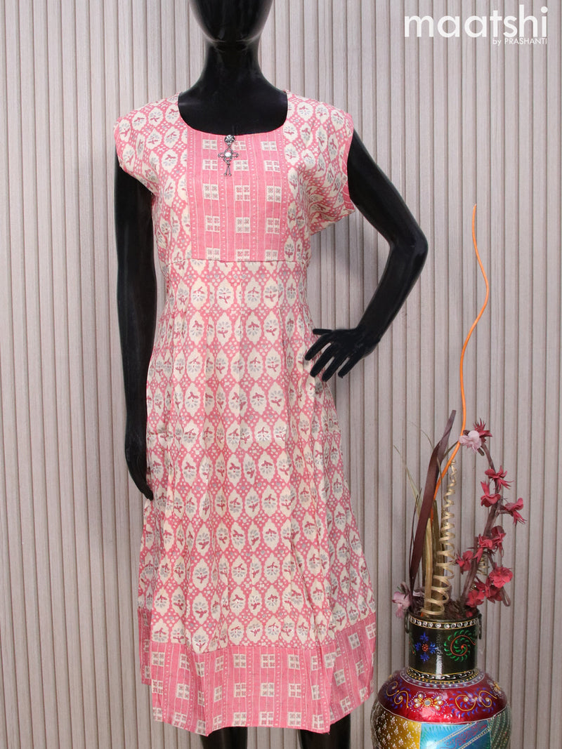 Rayon readymade umbrella kurti cream and pink with allover prints & simple neck pattern without pant