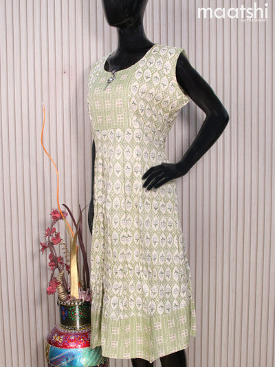 Rayon readymade umbrella kurti cream and green with allover prints & simple neck pattern without pant